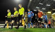 14 February 2011; The UCD and Lisburn Distillery teams are lead onto the pitch by the match officals. Setanta Sports Cup, Round 1 First Leg, UCD v Lisburn Distillery, Dalymount Park, Dublin. Picture credit: Barry Cregg / SPORTSFILE