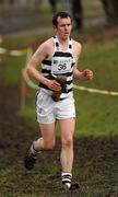 16 February 2011; Niall Walsh, St. Kieran's College, carries one of his spikes following it getting stuck in the mud during the Senior Boys event at the Aviva Leinster Schools Cross Country. Santry Demesne, Santry, Dublin. Picture credit: Stephen McCarthy / SPORTSFILE