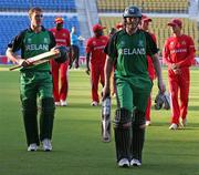 16 February 2011; Ireland's Kevin O'Brien, right, and John Mooney leave the field after their victory over Zimbabwe by four wickets. Warm-up Match, Ireland v Zimbabwe, Nagpur, India. Picture credit: Barry Chambers / Cricket Ireland / SPORTSFILE