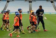 8 October 2016; Wexford hurler Lee Chin with children from Adamstown GAA in Wexford as Croke Park today played host to some of Ireland’s most talented hurlers, along with over 500 children, who lined-out to learn tips and skills from their hurling heroes as part of Centra’s Live Well hurling initiative. The participating children, who experienced a once in a lifetime opportunity, came from 12 lucky GAA clubs who each claimed their very special spot by winning a Live Well hurling challenge during the summer. Croke Park, Dublin. Photo by Piaras Ó Mídheach/Sportsfile
