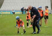 8 October 2016; Dublin hurler Dotsy O'Callaghan coaching Seán Furlong, age 6, from Adamstown GAA in Wexford, as Croke Park today played host to some of Ireland’s most talented hurlers, along with over 500 children, who lined-out to learn tips and skills from their hurling heroes as part of Centra’s Live Well hurling initiative. The participating children, who experienced a once in a lifetime opportunity, came from 12 lucky GAA clubs who each claimed their very special spot by winning a Live Well hurling challenge during the summer. Croke Park, Dublin. Photo by Piaras Ó Mídheach/Sportsfile