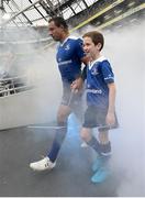 8 October 2016; Isa Nacewa of Leinster makes his way out onto the pitch with mascot Jack Caffrey, age 10, from Kilpedder, Co. Wicklow, ahead the Guinness PRO12 Round 6 match between Leinster and Munster at the Aviva Stadium in Lansdowne Road, Dublin. Photo by Seb Daly/Sportsfile