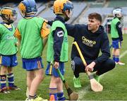 8 October 2016; Galway hurler Jason Flynn instructs members of the Newmarket On Fergus GAA Club at Croke Park today which played host to some of Ireland’s most talented hurlers, along with over 500 children, who lined-out to learn tips and skills from their hurling heroes as part of Centra’s Live Well hurling initiative. The participating children, who experienced a once in a lifetime opportunity, came from 12 lucky GAA clubs who each claimed their very special spot by winning a Live Well hurling challenge during the summer. Croke Park, Dublin. Photo by Cody Glenn/Sportsfile