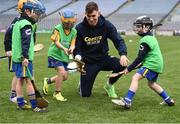 8 October 2016; Galway hurler Jason Flynn plays with members of the Newmarket On Fergus GAA Club at Croke Park today which played host to some of Ireland’s most talented hurlers, along with over 500 children, who lined-out to learn tips and skills from their hurling heroes as part of Centra’s Live Well hurling initiative. The participating children, who experienced a once in a lifetime opportunity, came from 12 lucky GAA clubs who each claimed their very special spot by winning a Live Well hurling challenge during the summer. Croke Park, Dublin. Photo by Cody Glenn/Sportsfile