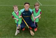 8 October 2016; Wexford hurler Lee Chin with Odhran Burke-Keaveney, age 5, and Mollie Burke, age 6, from Athenry in Galway as Croke Park today played host to some of Ireland’s most talented hurlers, along with over 500 children, who lined-out to learn tips and skills from their hurling heroes as part of Centra’s Live Well hurling initiative. The participating children, who experienced a once in a lifetime opportunity, came from 12 lucky GAA clubs who each claimed their very special spot by winning a Live Well hurling challenge during the summer. Croke Park, Dublin. Photo by Piaras Ó Mídheach/Sportsfile