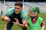 8 October 2016; Wexford hurler Lee Chin with James Burke, age 5, from Athenry in Galway as Croke Park today played host to some of Ireland’s most talented hurlers, along with over 500 children, who lined-out to learn tips and skills from their hurling heroes as part of Centra’s Live Well hurling initiative. The participating children, who experienced a once in a lifetime opportunity, came from 12 lucky GAA clubs who each claimed their very special spot by winning a Live Well hurling challenge during the summer. Croke Park, Dublin. Photo by Piaras Ó Mídheach/Sportsfile