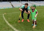 8 October 2016; Wexford hurler Lee Chin with James Burke, age 5, from Athenry in Galway as Croke Park today played host to some of Ireland’s most talented hurlers, along with over 500 children, who lined-out to learn tips and skills from their hurling heroes as part of Centra’s Live Well hurling initiative. The participating children, who experienced a once in a lifetime opportunity, came from 12 lucky GAA clubs who each claimed their very special spot by winning a Live Well hurling challenge during the summer. Croke Park, Dublin. Photo by Piaras Ó Mídheach/Sportsfile