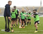 8 October 2016; Clare hurler Podge Collins coaches members of the Kilruane MacDonagh's GAA Club, Co Tipperary, including Grace Cleary, age 8, during a &quot;crossbar challenge&quot; at Croke Park today which played host to some of Ireland’s most talented hurlers, along with over 500 children, who lined-out to learn tips and skills from their hurling heroes as part of Centra’s Live Well hurling initiative. The participating children, who experienced a once in a lifetime opportunity, came from 12 lucky GAA clubs who each claimed their very special spot by winning a Live Well hurling challenge during the summer. Croke Park, Dublin. Photo by Cody Glenn/Sportsfile