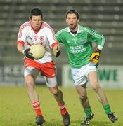 26 January 2011; Sean Cavanagh, Tyrone, in action against Kevin Cosgrove, Fermanagh. Barrett Sports Lighting Dr. McKenna Cup Section A, Fermanagh v Tyrone, Brewster Park, Enniskillen, Co. Fermanagh. Picture credit: Oliver McVeigh / SPORTSFILE