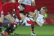 18 February 2011; Nevin Spence, Ulster, is tackled by the Scarlets defence. Celtic League, Scarlets v Ulster, Parc Y Scarlets, Llanelli, Wales. Picture credit: Steve Pope / SPORTSFILE