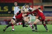 18 February 2011; Nevin Spence, Ulster, is tackled by Scott Williams and Rhys Priestland, Scarlets. Celtic League, Scarlets v Ulster, Parc Y Scarlets, Llanelli, Wales. Picture credit: Steve Pope / SPORTSFILE