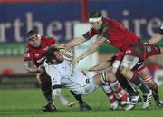 18 February 2011; Pedrie Wannenburg, Ulster, is tackled by Rhys Thomas and Josh Turnbull, right, Scarlets. Celtic League, Scarlets v Ulster, Parc Y Scarlets, Llanelli, Wales. Picture credit: Steve Pope / SPORTSFILE