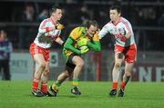 19 February 2011; Colm McFadden, Donegal, in action against Aidan McCrory and Enda McGinley, Tyrone. Allianz Football League, Division 2 Round 2, Tyrone v Donegal, Healy Park, Omagh, Co. Tyrone. Picture credit: Oliver McVeigh / SPORTSFILE