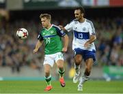 8 October 2016; Jamie Ward of Northern Ireland in action against Alessandro Della Vale of San Marino during the FIFA World Cup Group C Qualifier match between Northern Ireland and San Marino at Windsor Park in Belfast. Photo by Oliver McVeigh/Sportsfile