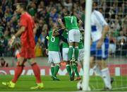 8 October 2016; Steve Davis of Northern Ireland, 8, celebrates with team mates after scoring his sides first goal from a penalty during the FIFA World Cup Group C Qualifier match between Northern Ireland and San Marino at Windsor Park in Belfast. Photo by Oliver McVeigh/Sportsfile