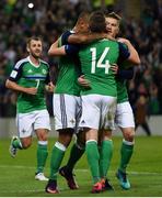 8 October 2016; Steven Davis is congratulated by team mates Stuart Dallas, 14 and Josh Magennis during the FIFA World Cup Group C Qualifier match between Northern Ireland and San Marino at Windsor Park in Belfast. Photo by David Fitzgerald/Sportsfile