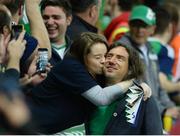 8 October 2016; Gary Lighbodyfrom the Northern Ireland band Snow Patrol getting a kiss from a fan during the parade of champions before the FIFA World Cup Group C Qualifier match between Northern Ireland and San Marino at Windsor Park in Belfast. Photo by Oliver McVeigh/Sportsfile