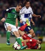 8 October 2016; Steven Davis of Northern Ireland in action against Aldo Simoncini of San Marino during the FIFA World Cup Group C Qualifier match between Northern Ireland and San Marino at Windsor Park in Belfast. Photo by David Fitzgerald/Sportsfile