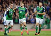 8 October 2016; Jamie Ward of Northern Ireland centre, celebartes with Steve Davis, left, and Conor Washington after scoring his sides third goal during the FIFA World Cup Group C Qualifier match between Northern Ireland and San Marino at Windsor Park in Belfast. Photo by Oliver McVeigh/Sportsfile