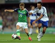8 October 2016; Jamie Ward of Northern Ireland in action against Alessandro Della Vale of San Marino during the FIFA World Cup Group C Qualifier match between Northern Ireland and San Marino at Windsor Park in Belfast. Photo by Oliver McVeigh/Sportsfile