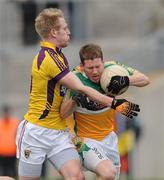 20 February 2011; Brian Darby, Offaly, in action against Sean O'Neill, Wexford. Allianz Football League, Division 3 Round 2, Offaly v Wexford, O'Connor Park, Tullamore, Co. Offaly. Picture credit: Ray McManus / SPORTSFILE