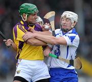 20 February 2011; Keith Rossiter, Wexford, is tackled by Stephen Molumphy and Richie Foley, Waterford. Allianz Hurling League, Division 1 Round 2, Wexford v Waterford, Wexford Park, Wexford. Picture credit: Matt Browne / SPORTSFILE