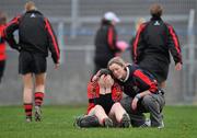 20 February 2011; A dejected Elaine O'Shea, University College Cork, is consoled at the end of the game by a team-mate after defeat to  Waterford IT. Ashbourne Cup Final, University College Cork v Waterford IT, Pearse Stadium, Salthill, Galway. Picture credit: David Maher / SPORTSFILE