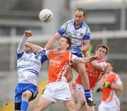20 February 2011; Mark Downey, left, and Gavin Doogan, Monaghan, in action against Finnian Moriarty and Kieran Toner, right, Armagh. Allianz Football League, Division 1 Round 2, Armagh v Monaghan, Athletic Grounds, Armagh. Picture credit: Oliver McVeigh / SPORTSFILE