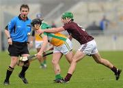 20 February 2011; Referee Barry Kelly keeps a close eye as Offaly's Declan Murphy is tackled by Daithí Waters, Galway. Allianz Hurling League, Division 1 Round 2, Offaly v Galway, O'Connor Park, Tullamore, Co. Offaly. Picture credit: Ray McManus / SPORTSFILE
