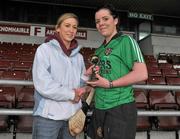 20 February 2011; Keelin Bradley, right, Queens University Belfast, is presented with the player of the match award by Niamh Kilkenny. Purcell Cup Final, DCU v Queens University Belfast, Pearse Stadium, Salthill, Galway. Picture credit: David Maher / SPORTSFILE