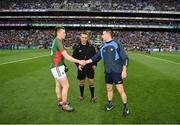 1 October 2016; Mayo captain Cillian O'Connor shakes hands with Dublin captain Stephen Cluxton in the presence of referee Maurice Deegan ahead of the GAA Football All-Ireland Senior Championship Final Replay match between Dublin and Mayo at Croke Park in Dublin. Photo by Ray McManus/Sportsfile