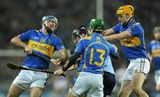 19 February 2011; Shane Durkin, Dublin, is tackled by Tipperary players Eoin Kelly, John O'Neill, and Pa Bourke. Allianz Hurling League, Division 1 Round 2, Dublin v Tipperary, Croke Park, Dublin. Picture credit: Ray McManus / SPORTSFILE