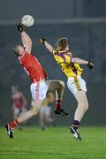 23 February 2011; David Maloney, Louth, in action against Emmet Kent, Wexford. Cadbury Leinster Under 21 Football Quarter-Final, Wexford v Louth, Belfield, Enniscorthy, Co. Wexford. Picture credit: Matt Browne / SPORTSFILE