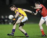 23 February 2011; Michael O'Regan, Wexford, in action against Eamonn O'Neill, Louth. Cadbury Leinster Under 21 Football Quarter-Final, Wexford v Louth, Belfield, Enniscorthy, Co. Wexford. Picture credit: Matt Browne / SPORTSFILE