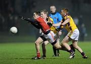 23 February 2011; Andy McDonnell, Louth, in action against James Breen and Emmet Kent, Wexford. Cadbury Leinster Under 21 Football Quarter-Final, Wexford v Louth, Belfield, Enniscorthy, Co. Wexford. Picture credit: Matt Browne / SPORTSFILE