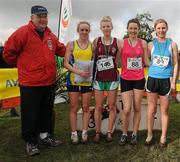 16 February 2011; Podium finishers, from left, Sorcha Nic Umfraidh, Colaiste Iosagain, fourth place, Niamh Kearney, Loreto Dalkey, third place, Maire Aine Ni Shuilleabhain, Gael Colaiste Ceatharlach, first place, and Mary Mulhare, Presentation Portlaoise, second place, with Fr. Ailibe O'Murchu OFM, President of the Leinster Schools' Athletics Union, following the Senior Girls event at the Aviva Leinster Schools Cross Country. Santry Demesne, Santry, Dublin. Picture credit: Stephen McCarthy / SPORTSFILE