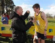 16 February 2011; Jim Dowdall, CEO of Aviva Ireland, makes presents third place Jack Kyle, King's Hospital, with his medal following the Minor Boys event at the Aviva Leinster Schools Cross Country. Santry Demesne, Santry, Dublin. Picture credit: Stephen McCarthy / SPORTSFILE