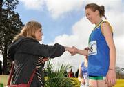 16 February 2011; Nicole Cuskelly, Killina SS Tullamore, is presented with her third place medal by Suzanne O'Dea, Aviva, following the Junior Girls event at the Aviva Leinster Schools Cross Country. Santry Demesne, Santry, Dublin. Picture credit: Stephen McCarthy / SPORTSFILE
