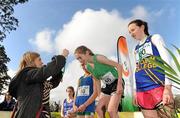 16 February 2011; Ella Fennelly, Mount Anville, is presented with her winners place medal by Suzanne O'Dea, Aviva, following the Junior Girls event at the Aviva Leinster Schools Cross Country. Santry Demesne, Santry, Dublin. Picture credit: Stephen McCarthy / SPORTSFILE