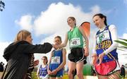 16 February 2011; Ella Fennelly, Mount Anville, is presented with her winners place medal by Suzanne O'Dea, Aviva, following the Junior Girls event at the Aviva Leinster Schools Cross Country. Santry Demesne, Santry, Dublin. Picture credit: Stephen McCarthy / SPORTSFILE