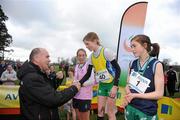 16 February 2011; Jim Dowdall, CEO of Aviva Ireland, presents Siofra Cleirigh Buttner Colaiste Iosagain, with her first place medal following the Intermediate Girls event at the Aviva Leinster Schools Cross Country. Santry Demesne, Santry, Dublin. Picture credit: Stephen McCarthy / SPORTSFILE