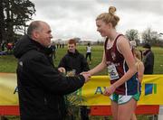 16 February 2011; Niamh Kearney, Loreto Dalkey, is presented with her third place medal by Jim Dowdall, CEO of Aviva Ireland, following the Senior Girls event at the Aviva Leinster Schools Cross Country. Santry Demesne, Santry, Dublin. Picture credit: Stephen McCarthy / SPORTSFILE