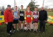 16 February 2011; Podium finishers, from left, M Kavanagh, Colaiste Raithin, fourth place, Jake Byrne, St Joseph's Rochfordbridge, third place, Kevin Dooney, CBC Monkstown, first place, and Liam Brady, St Brendan’s Birr, second place, with Fr. Ailibe O'Murchu OFM, President of the Leinster Schools' Athletics Union, and Liam Hennessy, President Athletics Ireland, right, following the Senior Boys event at the Aviva Leinster Schools Cross Country. Santry Demesne, Santry, Dublin. Picture credit: Stephen McCarthy / SPORTSFILE
