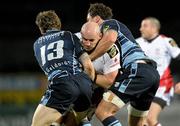 25 February 2011; Tim Barker, Ulster, is tackled by Gavin Evans, left, and Andries Pretorius, Cardiff Blues. Celtic League, Ulster v Cardiff Blues, Ravenhill Park, Belfast, Co. Antrim. Photo by Sportsfile