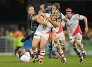 25 February 2011; Paddy McAllister, Ulster, is tackled by Deiniol Jones and Xavier Rush, right, Cardiff Blues. Celtic League, Ulster v Cardiff Blues, Ravenhill Park, Belfast, Co. Antrim. Photo by Sportsfile