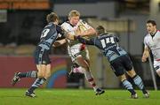 25 February 2011; Nevin Spence, Ulster, is tackled by Gavin Evans and Richard Mustoe, right, Cardiff Blues. Celtic League, Ulster v Cardiff Blues, Ravenhill Park, Belfast, Co. Antrim. Photo by Sportsfile
