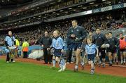26 February 2011; Paul Casey, Dublin, makes his way out on to the pitch with the mascots for the start of the game. Allianz Football League, Division 1, Round 3, Dublin v Kerry, Croke Park, Dublin. Photo by Sportsfile
