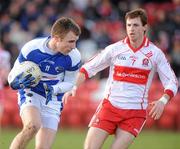 27 February 2011; Daithi Carroll, Laois, in action against Gerard O'Kane, Derry. Allianz Football League, Division 2, Round 3, Derry v Laois, Celtic Park, Derry. Picture credit: Oliver McVeigh / SPORTSFILE