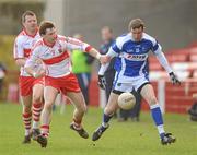 27 February 2011; Gary Kavanagh, Laois, in action against Gerard O'Kane, Derry. Allianz Football League, Division 2, Round 3, Derry v Laois, Celtic Park, Derry. Picture credit: Oliver McVeigh / SPORTSFILE