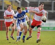27 February 2011; PJ McCloskey, Derry, in action against Colm Begley, Laois. Allianz Football League, Division 2, Round 3, Derry v Laois, Celtic Park, Derry. Picture credit: Oliver McVeigh / SPORTSFILE